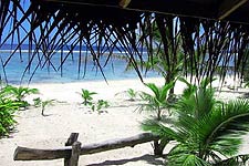 Raina Lagoon Villas offer deluxe bungalows with sea view balconies and tropical garden showers, right on the edge of a beautiful white sand  beach, great for swimming and snorkelling in the lagoon.
