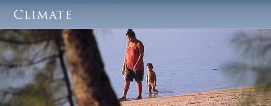 A mother and child strolling the beach